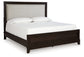 Ashley Express - Neymorton Queen Upholstered Panel Bed with 2 Nightstands